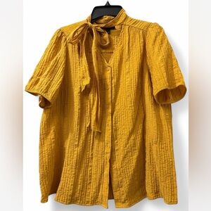 Mustard yellow short crepey fabric blouse w/tie front & puffed sleeves, size 14